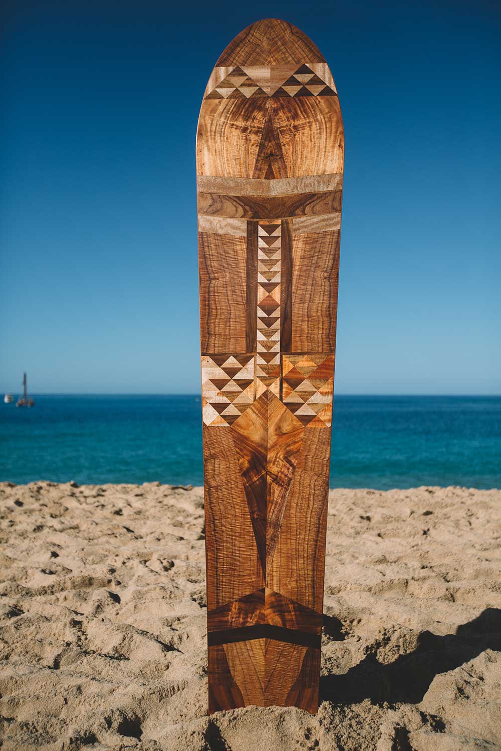 intricate wooden Hawaiian surfboard