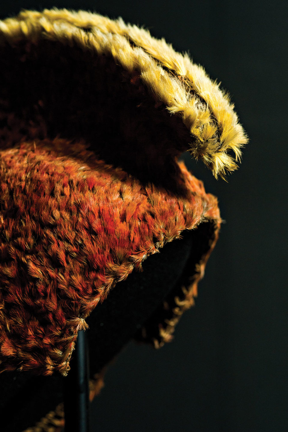 Red-orange and yellow feathered helmet from Hawaii